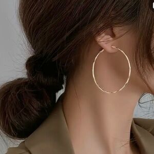 Brand new, never used gold-toned hoop earrings for pierced ears